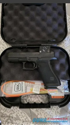 Glock 9mm MOS pistol with Aimpoint COA