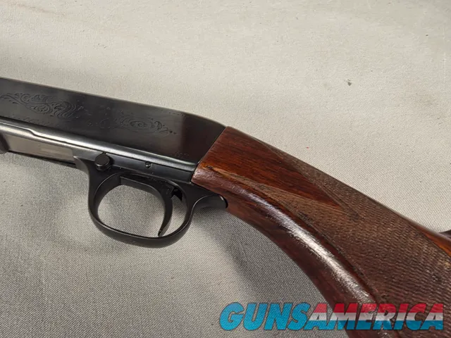 9431  Browning SA22 , 22 short, wheel sight, Belgium made, rare caliber, metal butt plate, one of the first made.
