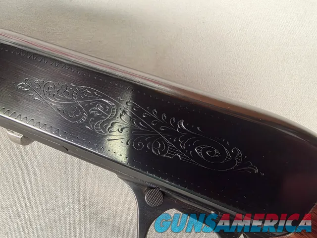 9431 Browning SA22 , 22 short, wheel sight, Belgium made, rare caliber, metal butt plate, one of the first made.