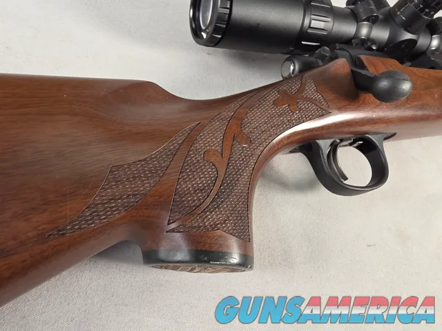 9484 Remington 700, 243 Caliber, 24” barrel, cheek piece, sling swivels, butt pad, DCR Sight man Scope, 3x12x44.
