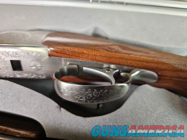9041 SKB Model 785 O/U 3 Gauge skeet set, 410 Gauge 3”, 28 Gauge 2 ¾, 20 Gauge 3”, All are 28” Barrels, All have their own f