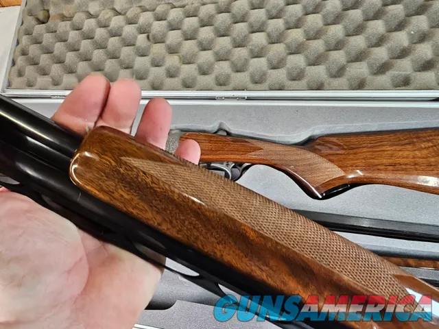9041 SKB Model 785 O/U 3 Gauge skeet set, 410 Gauge 3”, 28 Gauge 2 ¾, 20 Gauge 3”, All are 28” Barrels, All have their own f