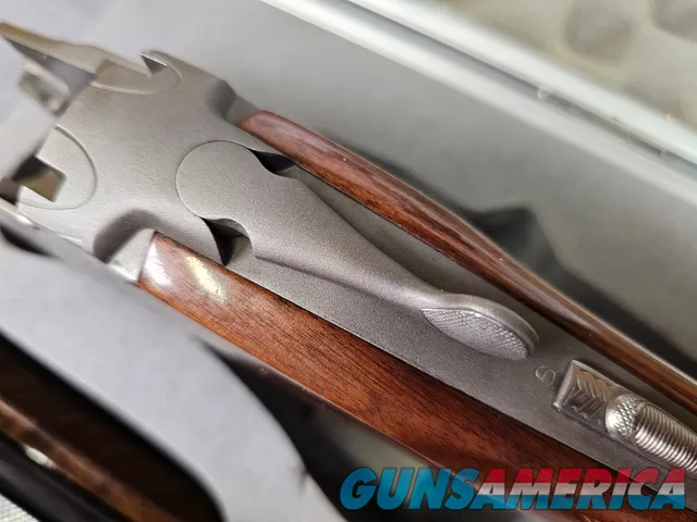 9041 SKB Model 785 O/U 3 Gauge skeet set, 410 Gauge 3”, 28 Gauge 2 ¾, 20 Gauge 3”, All are 28” Barrels, All have their own f