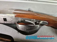 9041  SKB Model 785 O/U 3 Gauge skeet set, 410 Gauge 3”, 28 Gauge 2 ¾, 20 Gauge 3”, All are 28” Barrels, All have their own f