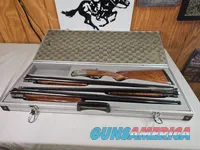 9041  SKB Model 785 O/U 3 Gauge skeet set, 410 Gauge 3”, 28 Gauge 2 ¾, 20 Gauge 3”, All are 28” Barrels, All have their own f