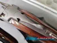 9041  SKB Model 785 O/U 3 Gauge skeet set, 410 Gauge 3”, 28 Gauge 2 ¾, 20 Gauge 3”, All are 28” Barrels, All have their own f