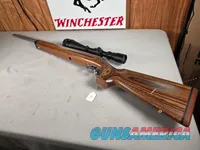 9379  Savage Model 12, 22-250,laminated stock, steel barrel, ebony forend cap, 24: barrel, Whitetail 6.5x20x50 scope,  More p