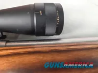 9379  Savage Model 12, 22-250,laminated stock, steel barrel, ebony forend cap, 24: barrel, Whitetail 6.5x20x50 scope,  More p