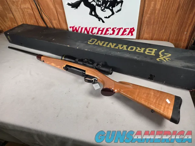 9398 Browning X Bolt, 270 Cal, 22” barrel, Rosewood cap, muzzle brake, Leupold 3.5x10x40 , Tiger striped wood, with box, Mor