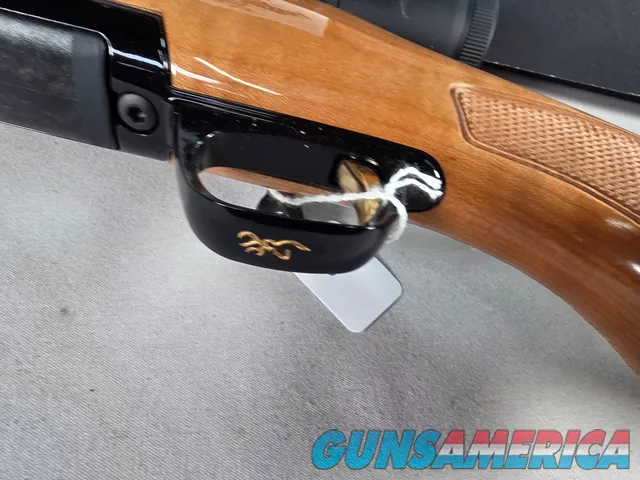 9398 Browning X Bolt, 270 Cal, 22” barrel, Rosewood cap, muzzle brake, Leupold 3.5x10x40 , Tiger striped wood, with box, Mor