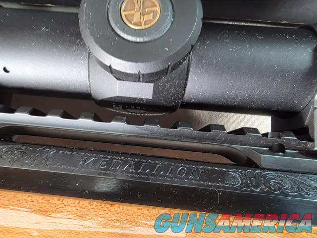 9398 Browning X Bolt, 270 Cal, 22” barrel, Rosewood cap, muzzle brake, Leupold 3.5x10x40 , Tiger striped wood, with box, Mor