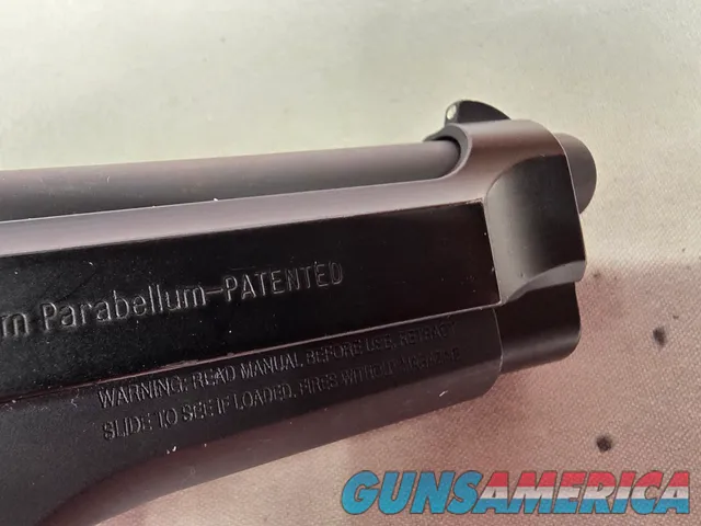 9487  Beretta 92FS, 9MM, 5” barrel, 2 Magazines 15 rounds each, laser in grip. Rubber grips. 