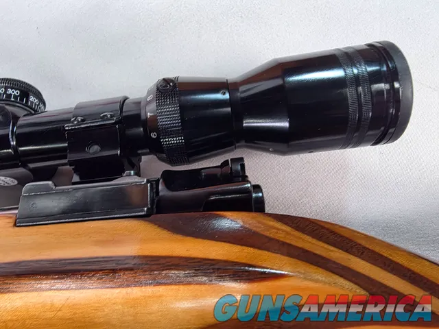 9380 Mauser Model 98 custom, 22-250, 24” barrel, bi pod, laminated stock, light trigger, custom bolt knob, cheek piece, tasco