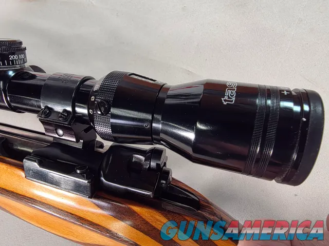 9380 Mauser Model 98 custom, 22-250, 24” barrel, bi pod, laminated stock, light trigger, custom bolt knob, cheek piece, tasco