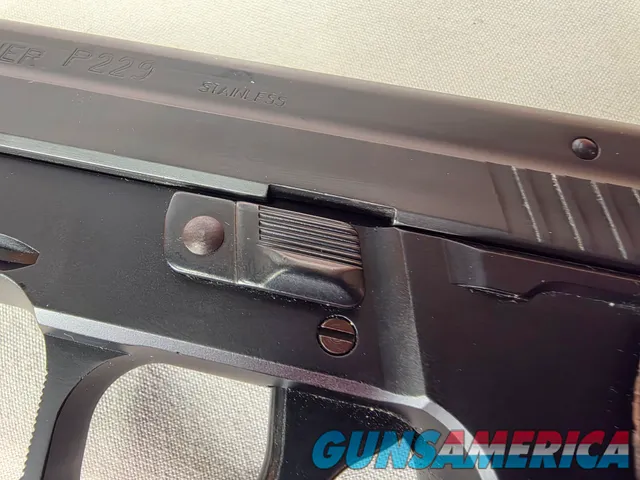 9488  Sig Sauer P229, 40 S+W, 3” Barrel, Night sights, 3-12 Round Magazines, Wood grips on it, with extra rubber grips. Can m