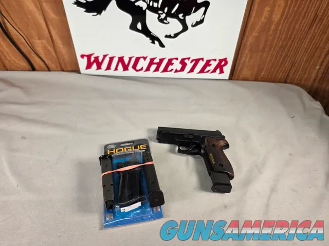 9488  Sig Sauer P229, 40 S+W, 3” Barrel, Night sights, 3-12 Round Magazines, Wood grips on it, with extra rubber grips. Can m