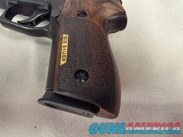 9488  Sig Sauer P229, 40 S+W, 3” Barrel, Night sights, 3-12 Round Magazines, Wood grips on it, with extra rubber grips. Can m