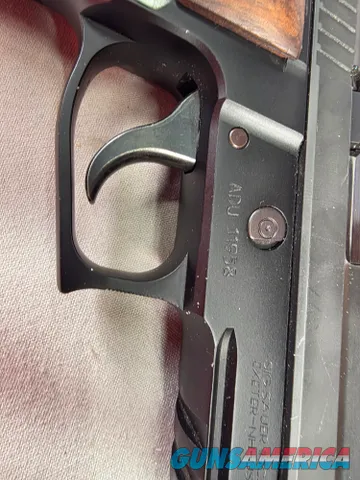 9488  Sig Sauer P229, 40 S+W, 3” Barrel, Night sights, 3-12 Round Magazines, Wood grips on it, with extra rubber grips. Can m