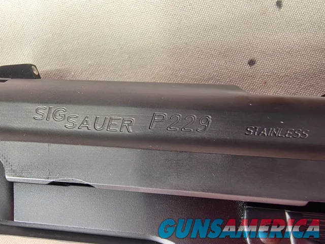 9488  Sig Sauer P229, 40 S+W, 3” Barrel, Night sights, 3-12 Round Magazines, Wood grips on it, with extra rubber grips. Can m