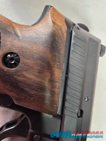 9488  Sig Sauer P229, 40 S+W, 3” Barrel, Night sights, 3-12 Round Magazines, Wood grips on it, with extra rubber grips. Can m
