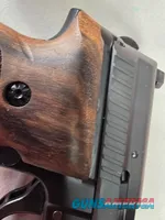 9488  Sig Sauer P229, 40 S+W, 3” Barrel, Night sights, 3-12 Round Magazines, Wood grips on it, with extra rubber grips. Can m