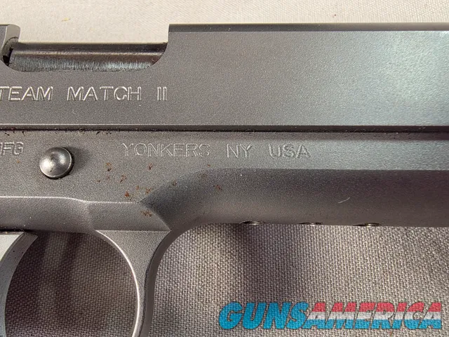 9443 Kimber Team Match II 9MM, 3 mags, 2 holsters, pouch, 2 sets of wood grips, adjustable rear sight, crimson trace laser.  