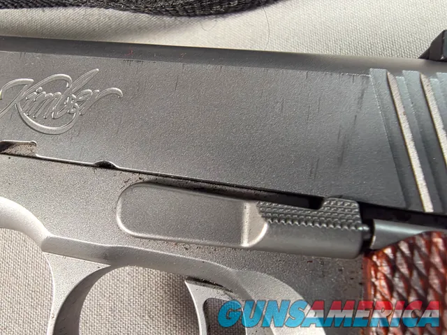 9443 Kimber Team Match II 9MM, 3 mags, 2 holsters, pouch, 2 sets of wood grips, adjustable rear sight, crimson trace laser.  