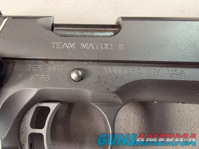 9443 Kimber Team Match II 9MM, 3 mags, 2 holsters, pouch, 2 sets of wood grips, adjustable rear sight, crimson trace laser.  