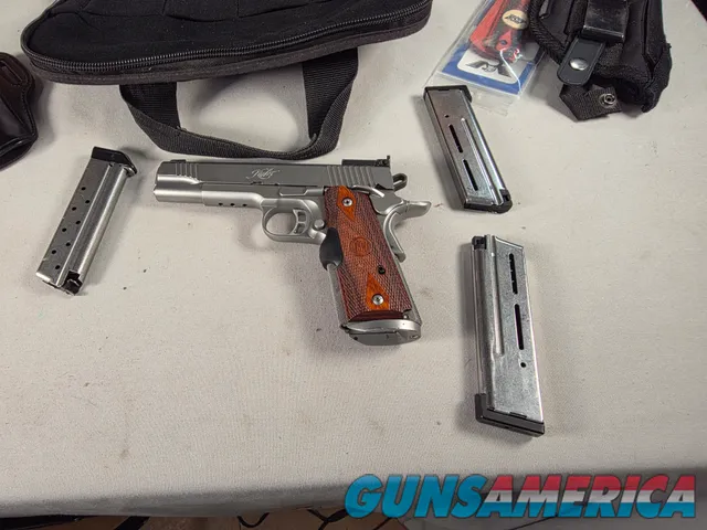 9443 Kimber Team Match II 9MM, 3 mags, 2 holsters, pouch, 2 sets of wood grips, adjustable rear sight, crimson trace laser.  