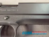 9443 Kimber Team Match II 9MM, 3 mags, 2 holsters, pouch, 2 sets of wood grips, adjustable rear sight, crimson trace laser.  