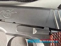 9443 Kimber Team Match II 9MM, 3 mags, 2 holsters, pouch, 2 sets of wood grips, adjustable rear sight, crimson trace laser.  
