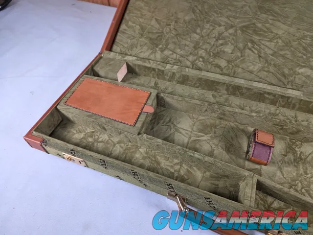 9449 Winchester Shotgun hard trunk style case. Green exterior with green interior, Has a spacing block and the original keys.