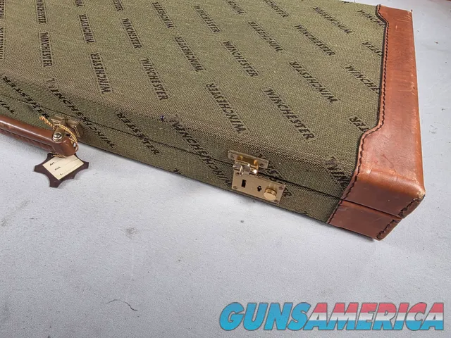 9449 Winchester Shotgun hard trunk style case. Green exterior with green interior, Has a spacing block and the original keys.