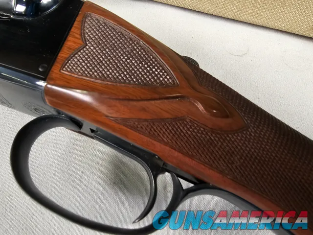 9111  Classic Doubles 12 gauge, 26 “ Barrels, IC/MOD, AA++ Marbled Walnut, Butt pad, vent rib, ejectors, Pistol grip with cap
