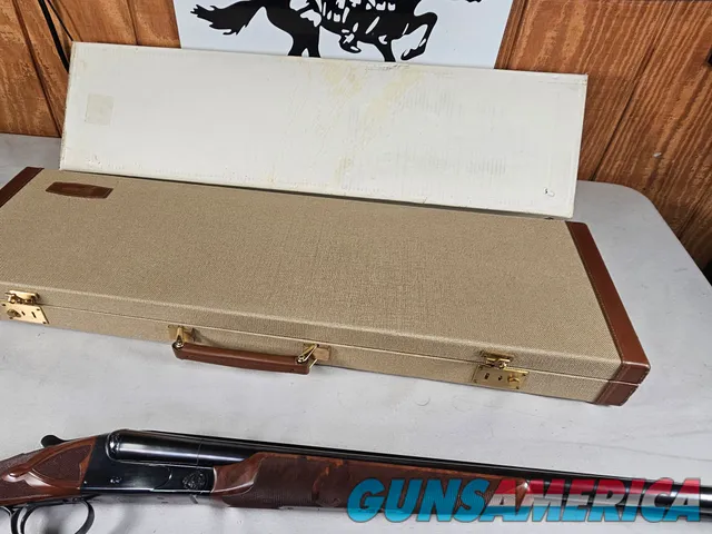 9111  Classic Doubles 12 gauge, 26 “ Barrels, IC/MOD, AA++ Marbled Walnut, Butt pad, vent rib, ejectors, Pistol grip with cap