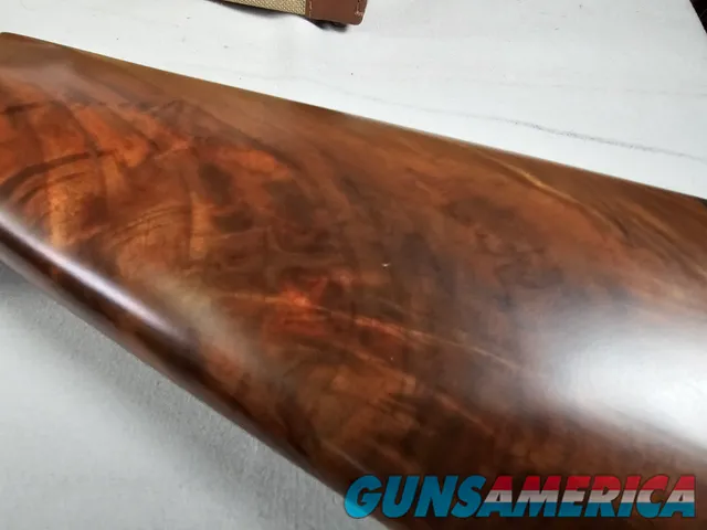 9111  Classic Doubles 12 gauge, 26 “ Barrels, IC/MOD, AA++ Marbled Walnut, Butt pad, vent rib, ejectors, Pistol grip with cap