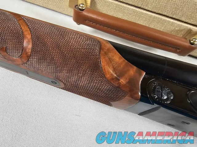 9111  Classic Doubles 12 gauge, 26 “ Barrels, IC/MOD, AA++ Marbled Walnut, Butt pad, vent rib, ejectors, Pistol grip with cap