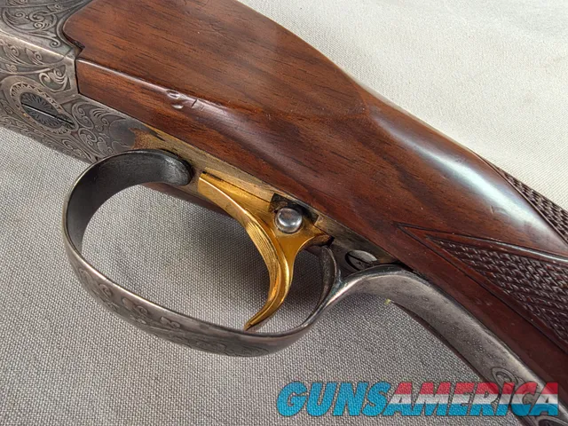 9269  Ithaca/ SKB  600 20 gauge, 26” barrels, M/F, single selective gold trigger, pistol grip with cap, butt plate, ejectors,