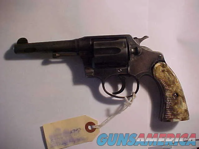 Vintage blued double-action revolver with holster