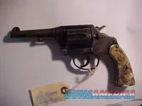 Vintage blued double-action revolver with holster