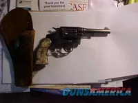 Vintage blued double-action revolver with holster