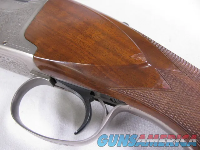 8123  Winchester Super grade 12 gauge over 222 Remington. Only 1000 ever produced