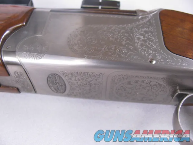 8123  Winchester Super grade 12 gauge over 222 Remington. Only 1000 ever produced