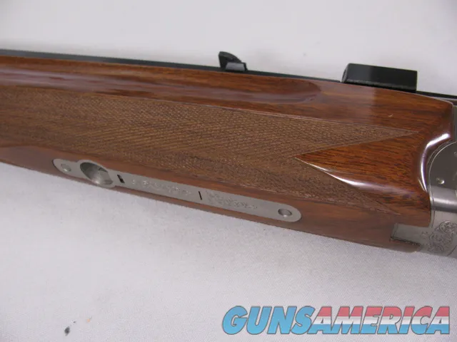 8123  Winchester Super grade 12 gauge over 222 Remington. Only 1000 ever produced