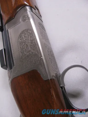 8123  Winchester Super grade 12 gauge over 222 Remington. Only 1000 ever produced