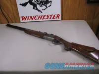 8123  Winchester Super grade 12 gauge over 222 Remington. Only 1000 ever produced