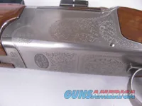 8123  Winchester Super grade 12 gauge over 222 Remington. Only 1000 ever produced
