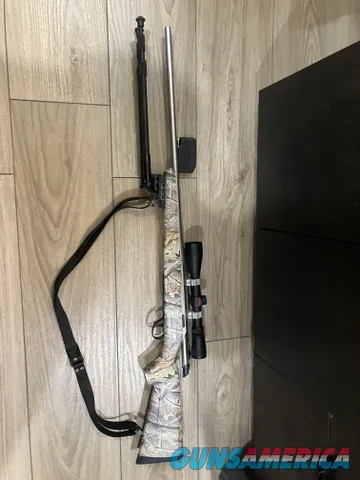 Tikka 270 WSM Camo bolt-action rifle with scope and sling