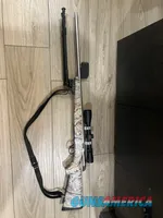 Tikka 270 WSM Camo bolt-action rifle with scope and sling