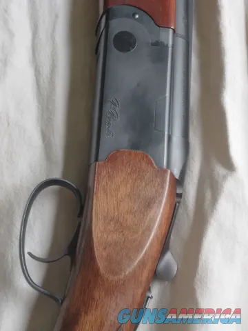 Beretta over/under shotgun with blued barrels